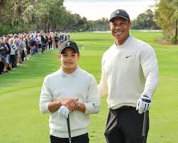 Charlie Woods finishes in three-way tie for 32nd in American Junior Golf Association debut. video below