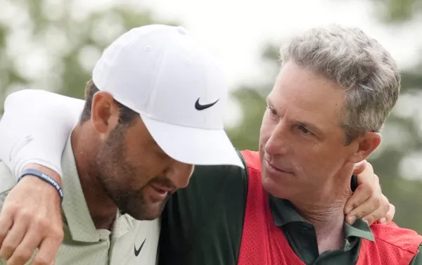 Scottie Scheffler’s caddie Ted Scott chose violence when a keyboard warrior on X suggested millions of people could loop for the PGA Tour star.